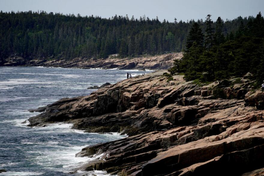 Visitors explore the rocky coast of Acadia National Park, Saturday, June 11, 2022, near Bar Harbor, Maine. The park recorded more than 4 million visitors in 2021. (Robert F. Bukaty/AP)