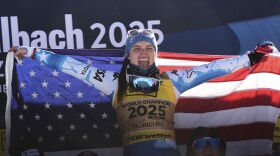 United States' Breezy Johnson celebrates on the podium after winning the gold medal in a women's downhill race, at the Alpine Ski World Championships, in Saalbach-Hinterglemm, Austria, Saturday, Feb. 8, 2025.