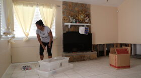 Sally Lacour cleans out her home after it was inundated with water after torrential rains caused widespread flooding during Hurricane and Tropical Storm Harvey on Sept. 2, 2017, in Houston. (Joe Raedle/Getty Images)