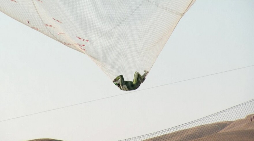 Now here's your closeup: After his two-minute free fall, Aikins successfully lands in the 100-by-100-foot net at the Big Sky Ranch in Simi Valley, Calif., on Saturday.