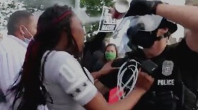 Kansas City Police Officer Nicholas McQuillen sprays a juvenile in the face during the May 30, 2020 protests near the Plaza. A Jackson County grand jury has indicted the officer. He faces a single misdemeanor count of 4th degree assault.