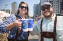 two people pose with beer steins 