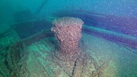 In this photo released by the Wisconsin Historical Society, quagga mussels cover the capstan of the F.J. King shipwreck in Lake Michigan on Aug. 23, 2025. (Wisconsin Historical Society via AP)