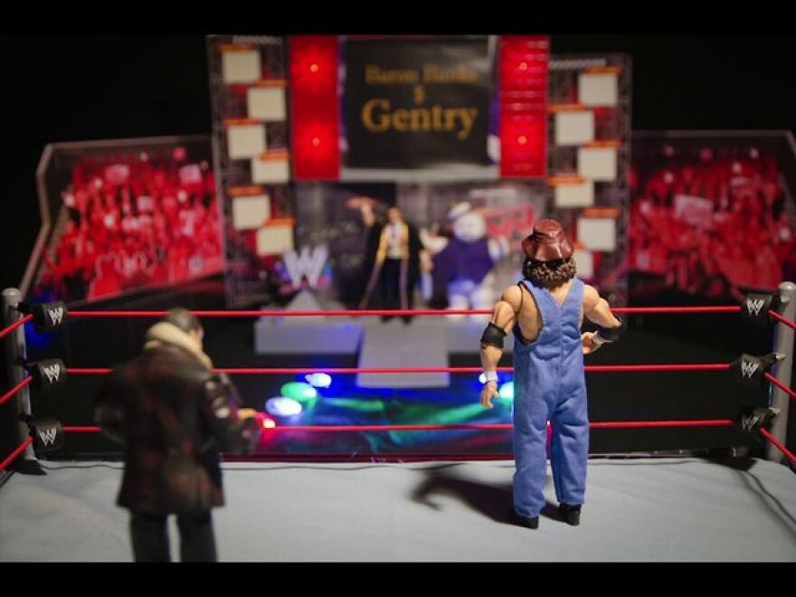 Action Figures In Wrestling Match: A Still From Barbecue Man Unleashed