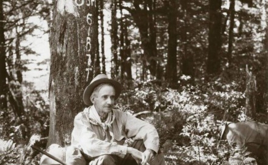 Kephart sitting with his back against a tree.