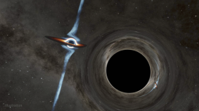 This is an illustration from Caltech shows how two black holes are circling each other. Credit: Caltech-IPAC