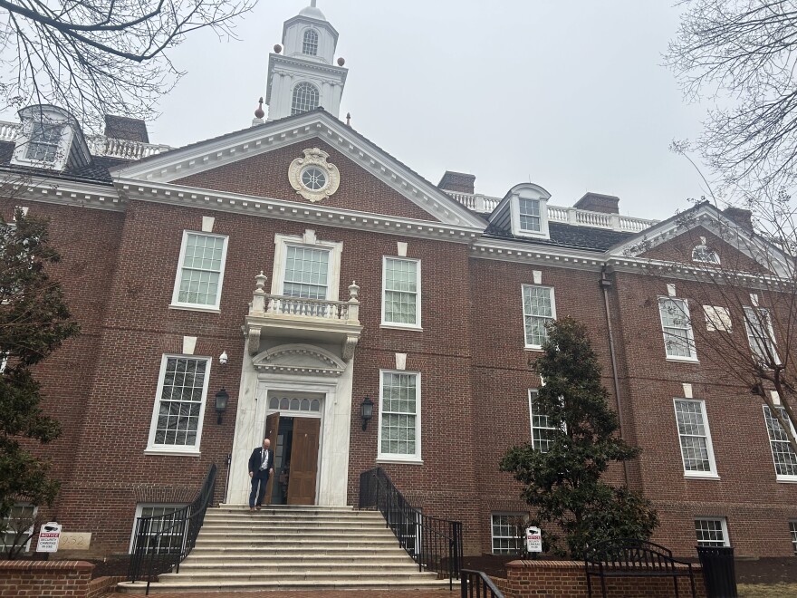 man exits front doors of legislative hall in Dover