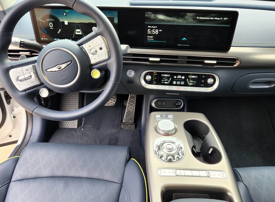 The usual cruise and computer control buttons are on the steering wheel hub and there’s a wireless charger in the console, just vertically insert the phone in front of the armrest.