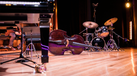 The instruments of a jazz band are set up on a stage. 
