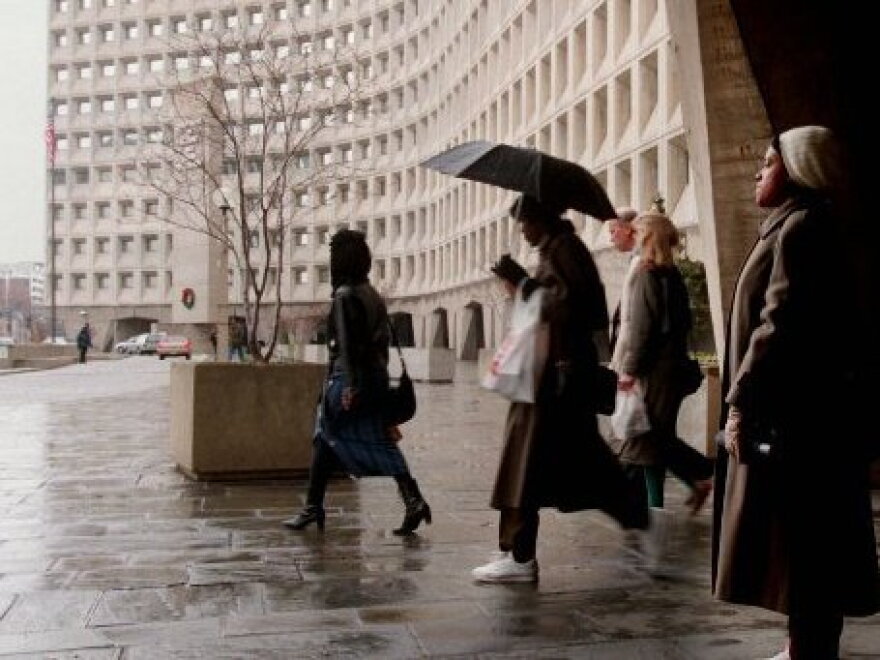Shutdown flashback: Department of Health and Human Services employees leave their building in Washington after being told to go home as part of a federal shutdown in 1995.