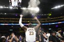 Los Angeles Lakers forward LeBron James tosses powder in the air prior to an NBA basketball game against the Denver Nuggets Saturday, March 2, 2024, in Los Angeles. 