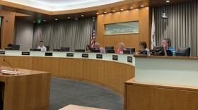 Wintergreen subdivision resident Dane Simpson, left, addresses the Normal Town Council on Tuesday, Sept. 6, 2022, in council chambers, Uptown Station, Normal.