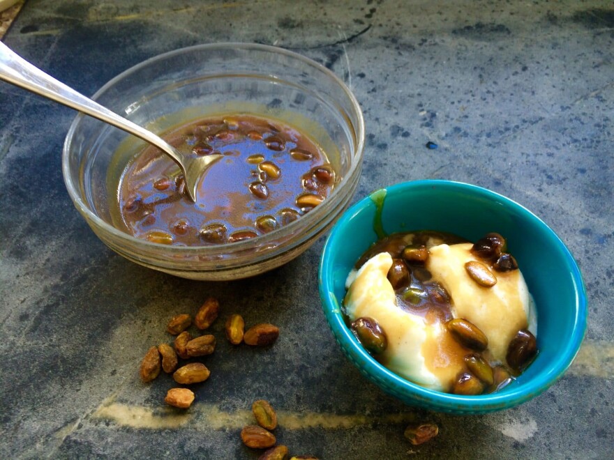 Kathy's sea salt-caramel-pistachio ice cream sauce drizzled over a bowl of ice cream. (Kathy Gunst for Here & Now)