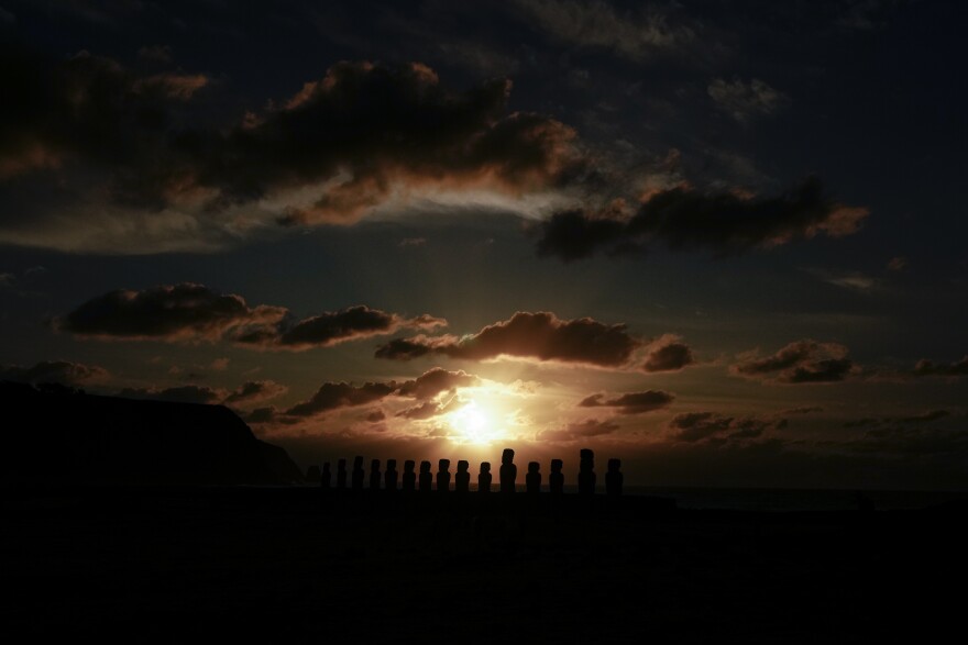 The sun rises behind moais statues on Ahu Tongariki, Rapa Nui, or Easter Island, early Thursday, Oct. 3, 2024.