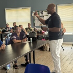 Dale Morgan speaking about financial literacy to the Women's Recovery Program at the Hope Center.