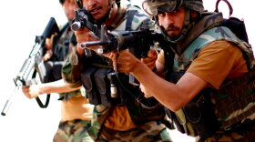 Afghan commandos work on clearing a mock house during a training session conducted by the U.S. Army Special Forces at Fire Base Thomas in western Afghanistan.