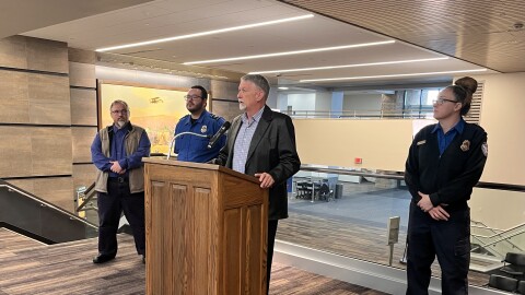 Billings Director of Aviation Jeff Roach speaks at Billings Logan International Airport Tuesday. TSA Federal Security Director for Montana KC Wurstbaugh stands on the far left.