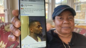 Glenda Brown Thomas displays a photo of her nephew, Andrew Brown Jr. on Thursday. He was shot and killed Wednesday by a sheriff's deputy who was attempting to execute a warrant.