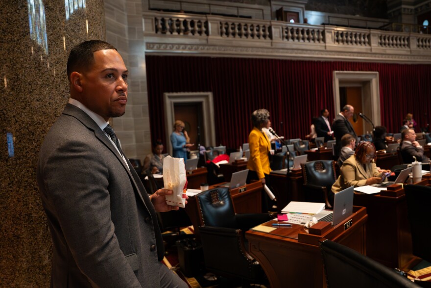 Missouri state Rep. Mark Sharp, D-Kansas City, listens to Republicans advocate for congressional redistricting while eating popcorn during an extraordinary legislative session Monday, Sept. 8, 2025, at the Missouri State Capitol in Jefferson City, Mo.
