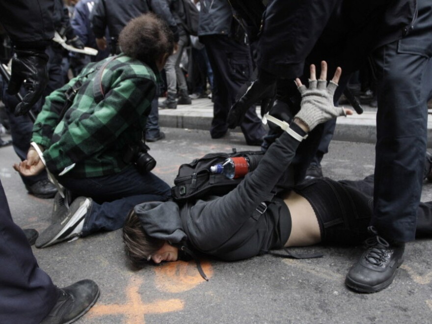 Police officers arrest demonstrators affiliated with the Occupy Wall Street movement in New York on Thursday.