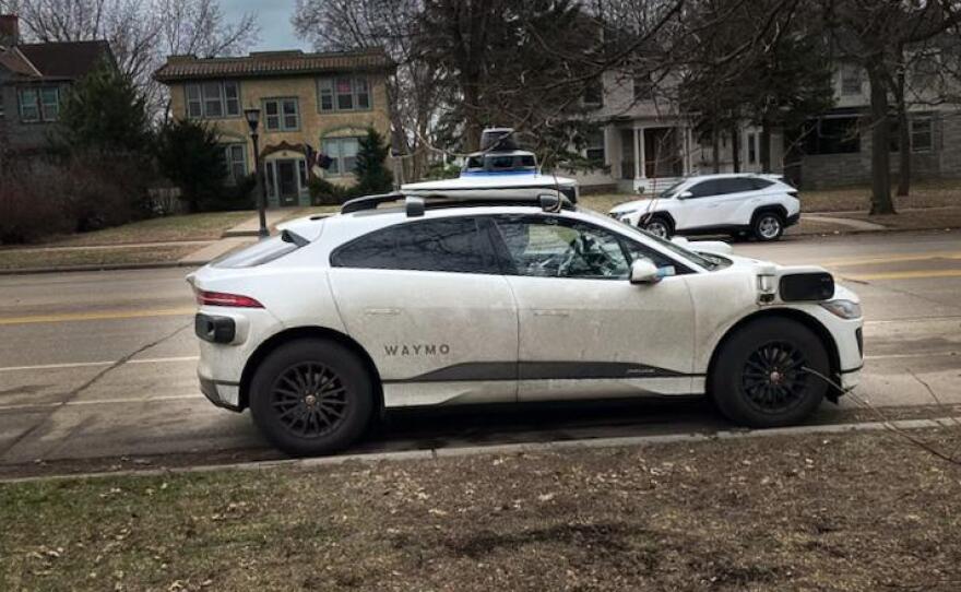 A Waymo autonomous vehicle is parked Thursday, March 26, 2026, on Marshall Avenue in St. Paul.