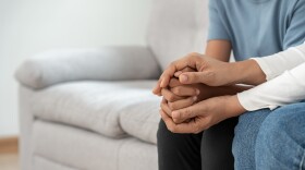 parent and child have conversation on couch