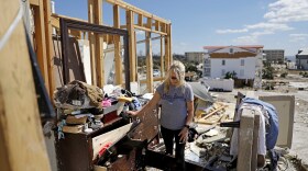 Candace Phillips sifts through what was her third-floor bedroom on Oct 14, 2018. Her Mexico Beach, Fla. home was destroyed by Hurricane Michael.