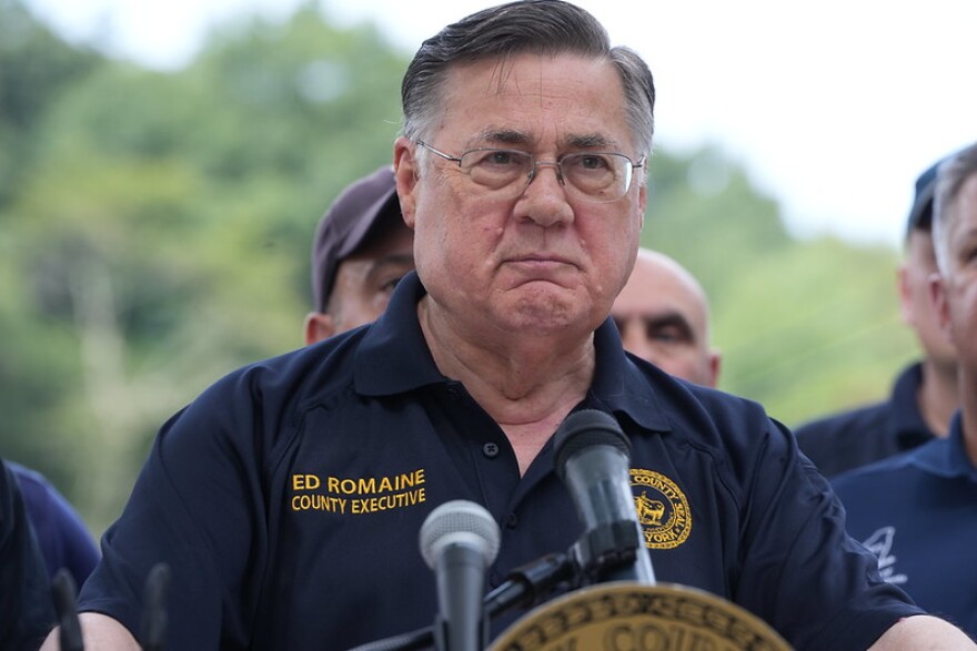Suffolk County Executive Ed Romaine is speaking in front of Mill Pond in Stony Brook.