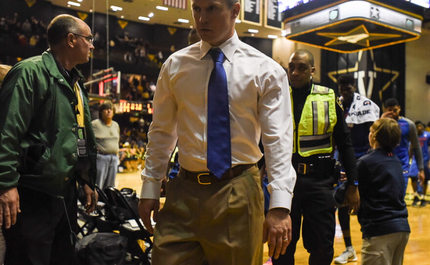 After his team loses by one point in the final second, Florida coach Michael White exists the court and heads back to the team's locker room. (Greenberry Taylor/WUFT News)