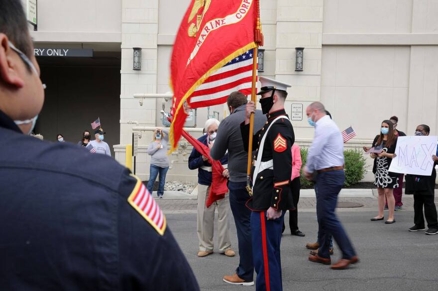 Max Deweese (with mask) at a surprise ceremony  May 7, the day of his release from a rehab facility, given by the Friends in Service of Heroes organization, which honors military veterans. 