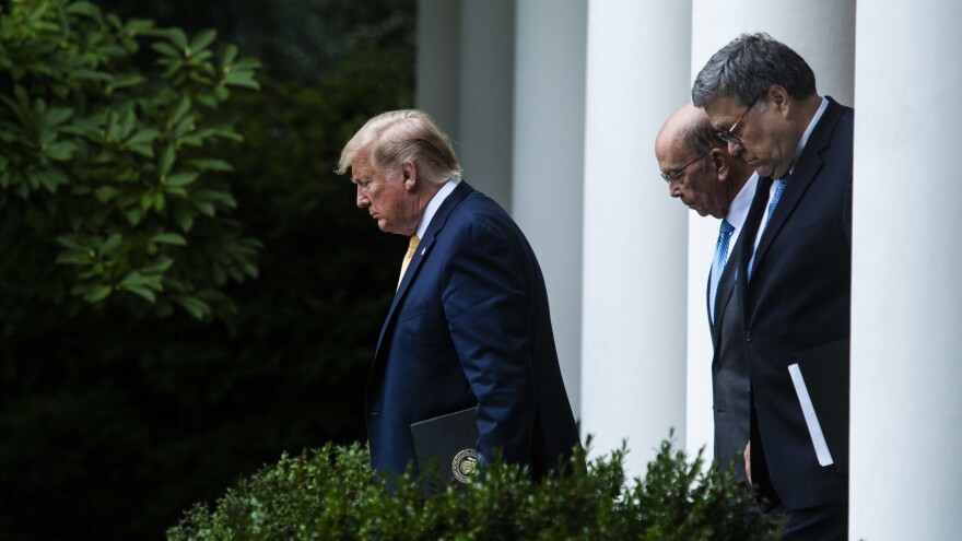 President Trump, Commerce Secretary Wilbur Ross (center) and Attorney General William Barr walk into the White House Rose Garden for a July 2019 press conference on the census.