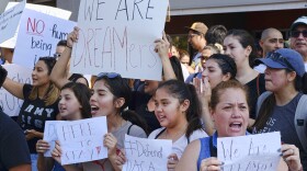 Supporters of the Deferred Action for Childhood Arrivals, or DACA chant slogans and holds signs while joining a Labor Day rally in downtown Los Angeles on Monday, Sept. 4. (Richard Vogel/AP)