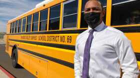 Brandon George is transportation director for the Paradise Valley Unified School District in Phoenix. PVUSD is short nearly 40 bus drivers at the start of the school year. (Peter O'Dowd/Here & Now)