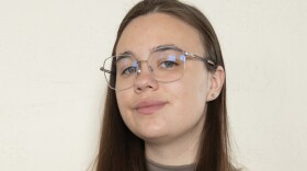 Sophia Holm is looking toward the camera while smiling.