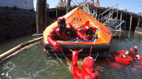 Mariners practicing abandon ship drills during an AMSEA training session.