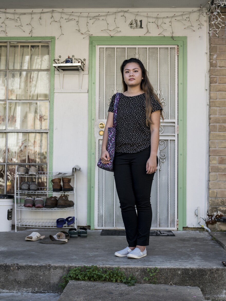 My Linh Tran, 22, a 4th grade school teacher, in front of her family's apartment at the Thai Xuan Village apartment complex in Houston