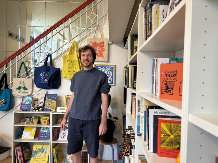 Alex Tomlinson, co-owner of Pigeon Post Art & Books, created the design for the "Support Scranton Independent Booksellers" merchandise.