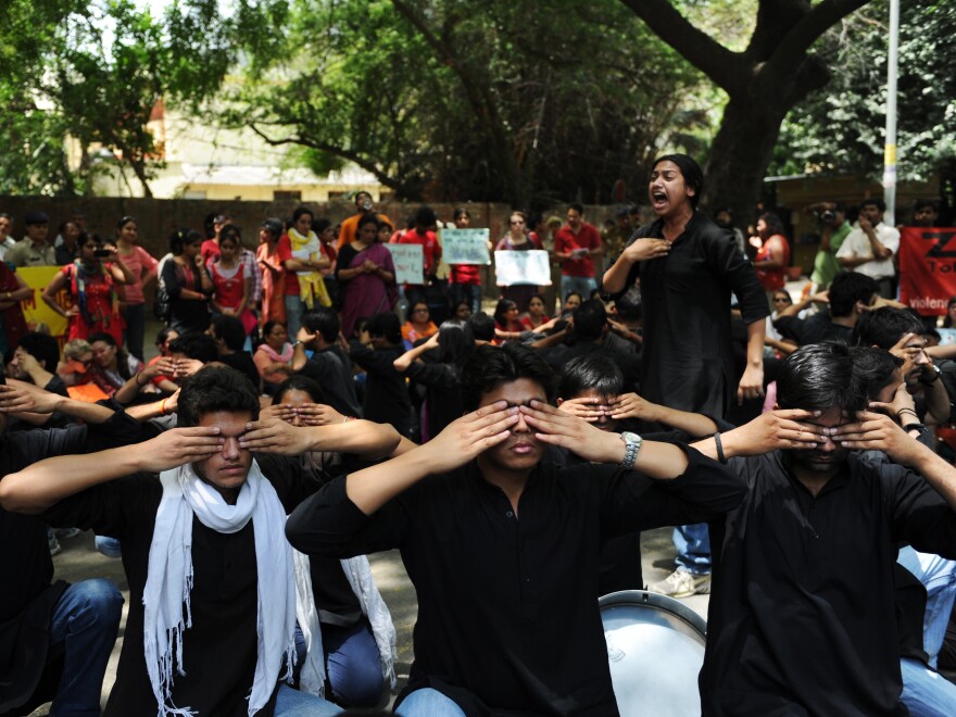 Protesters take part in a street play during a protest against growing cases of sexual abuse in New Delhi on May 5. The protesters urged  police to protect women from abusers and stop blaming victims for attacks.