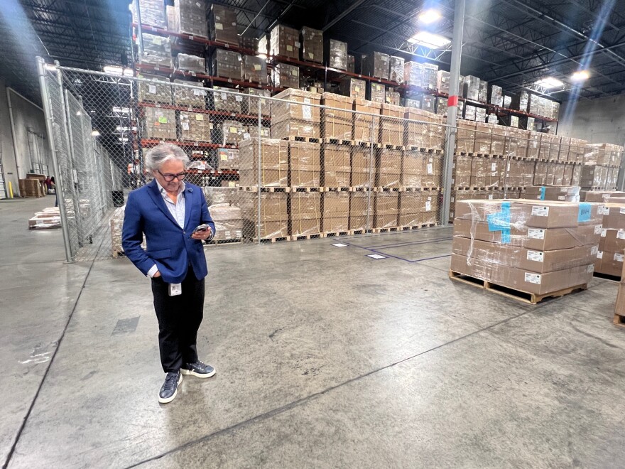 Founder and President of EP Logistics Octavio Saavedra stands inside one of his massive warehouses in El Paso filled with imported goods in boxes stacked to the ceiling that are part of cross border supply chains.