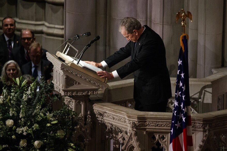 Former President George W. Bush fights back tears as he speaks during the State Funeral for his father, former President George H.W. Bush, at the National Cathedral, Wednesday, Dec. 5, 2018, in Washington.