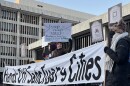 Dozens of demonstrators who rallied on Monday evening, March 2, 2026, outside the Kenneth B. Keating Federal Building and U.S. Courthouse on State Street in downtown Rochester.