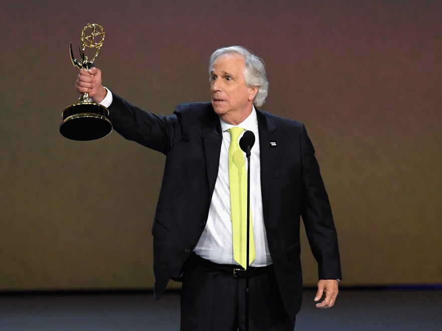 Henry Winkler accepts the award for outstanding supporting actor in a comedy series for 'Barry' during the 70th Emmy Awards.