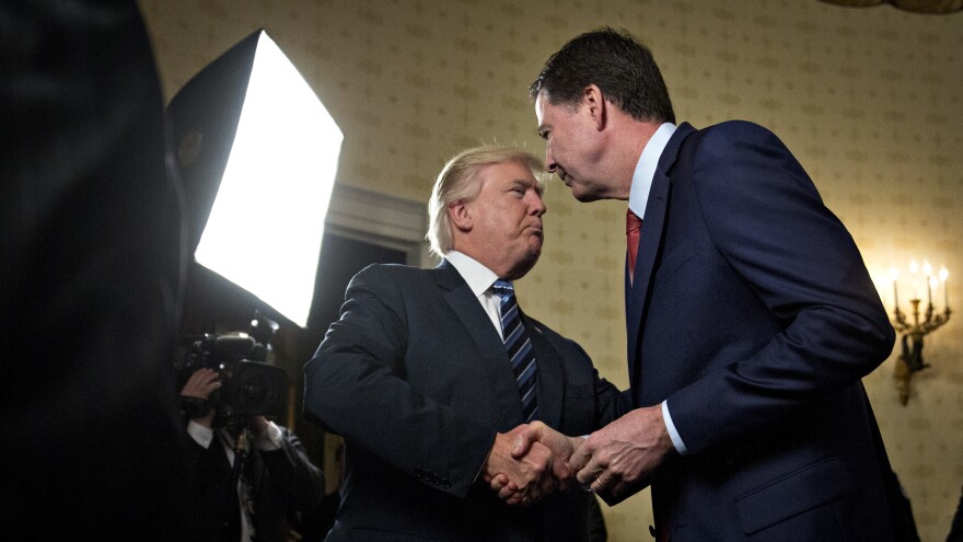 President Trump shakes hands with James Comey, then-director of the FBI, during a reception at the White House on Jan. 22.
