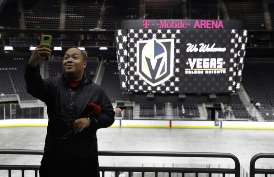 Jay Deogracias takes a selfie during an event to unveil the name of Las Vegas' National Hockey League franchise, Tuesday, Nov. 22, 2016, in Las Vegas.