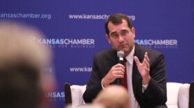 Republican Derek Schmidt speaks to a crowd at a Kansas Chamber of Commerce candidate forum.
