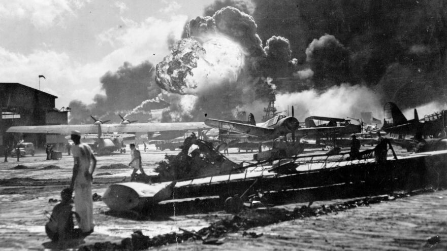 An explosion at the Naval Air Station Ford Island, Pearl Harbor, is seen during the Japanese attack. The U.S. is marking the 75th anniversary of the violence that thrust the country into World War II.