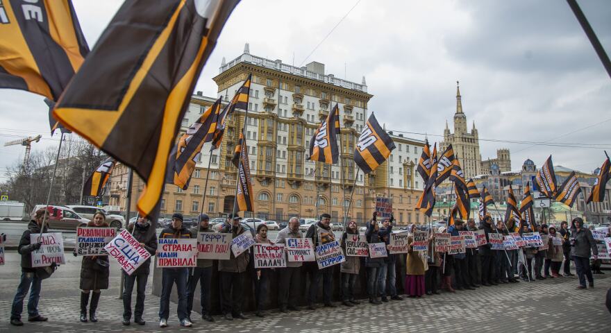 Russian demonstrators hold anti-American posters outside the U.S. Embassy in 2015. From the 1960s through the 1980s, the U.S. said the Soviet Union beamed microwave signals at the U.S. Embassy in an attempt to collect intelligence.