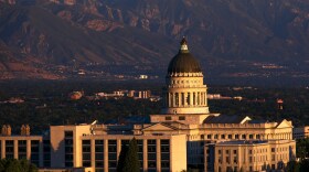 The Utah state capitol is backed by mountains. 