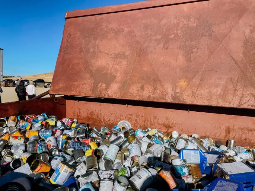 A dumpster full of cans waiting to be recycled at the Montezuma County landfill.