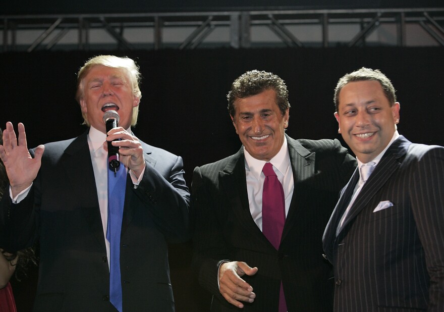 Donald Trump speaks alongside Bayrock's Tevfik Arif and Felix Sater at the Trump SoHo launch party in September 2007.